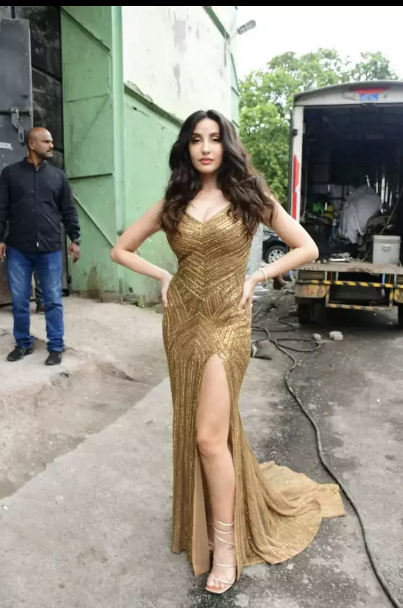 Nora Fatehi Flaunts Her Toned Curves In Golden Shimmery Bodycon Gown Bollywood Juncture 