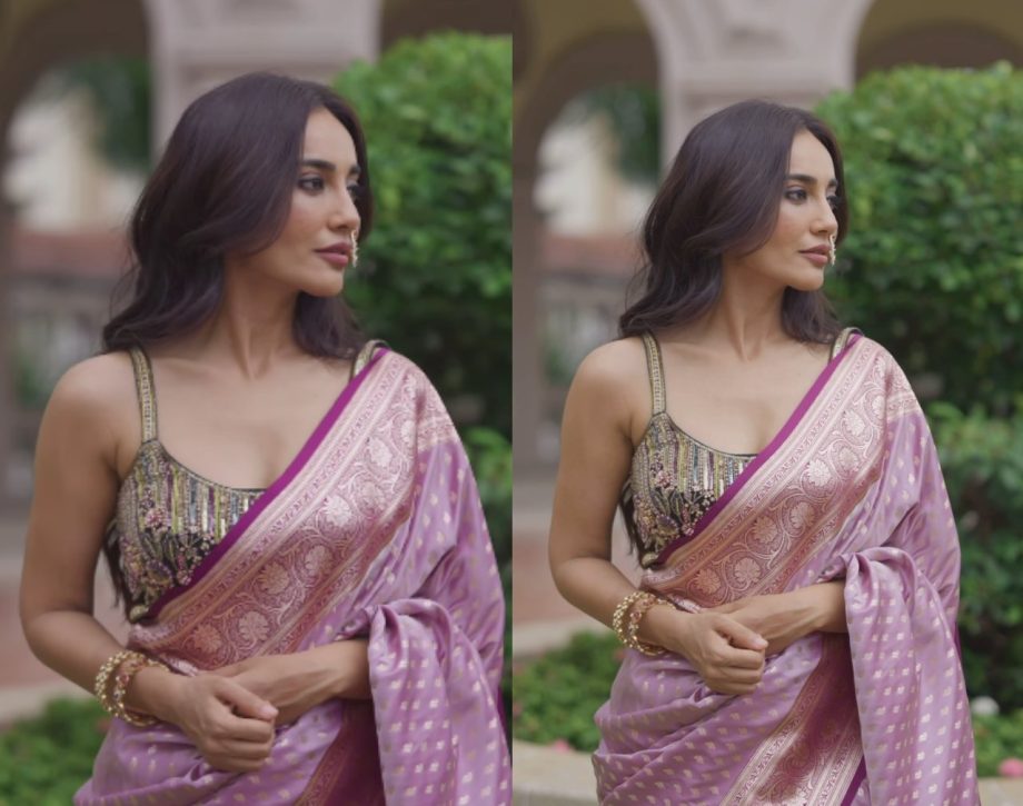 Surbhi effortlessly carries off a purple-pink saree with a blend of ...